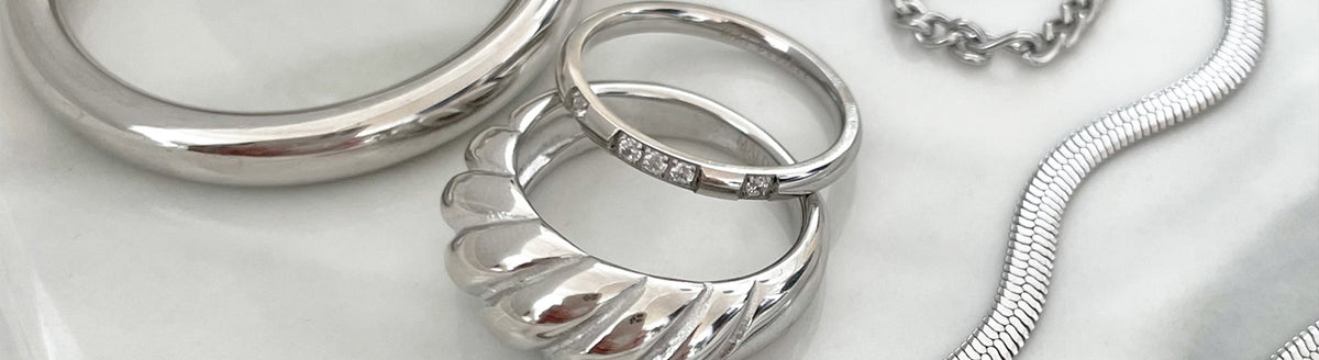 Silver waterproof jewelry collection, tarnish-free rings, necklaces and earrings, hypoallergenic and shower-safe.
