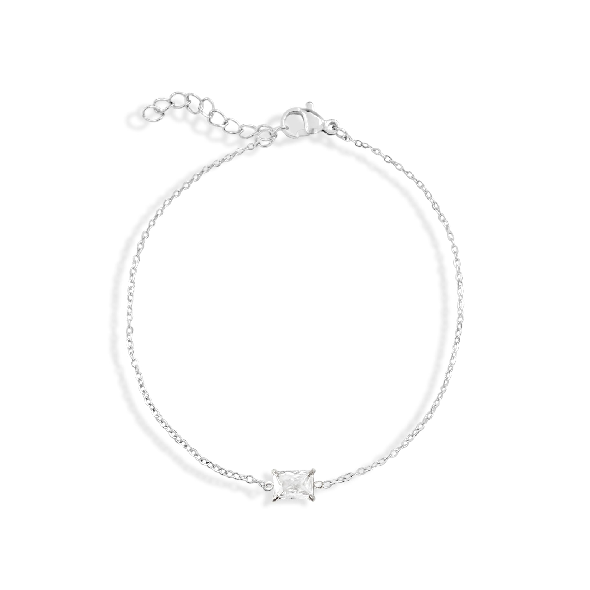 Silver bracelet with a emerald
 diamond on a white background