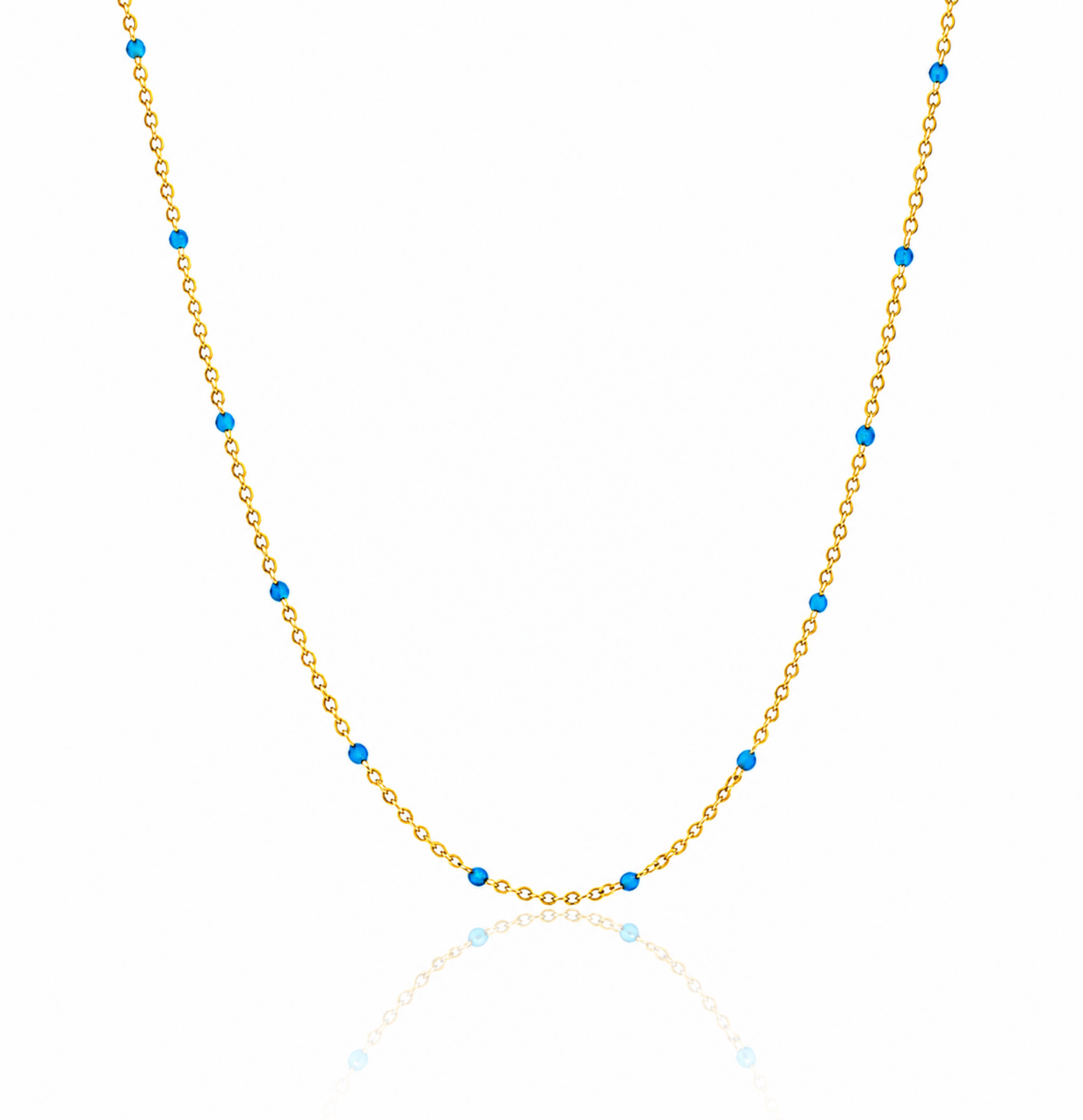 Gold necklace with blue beads on a gold dainty chain necklace and white background