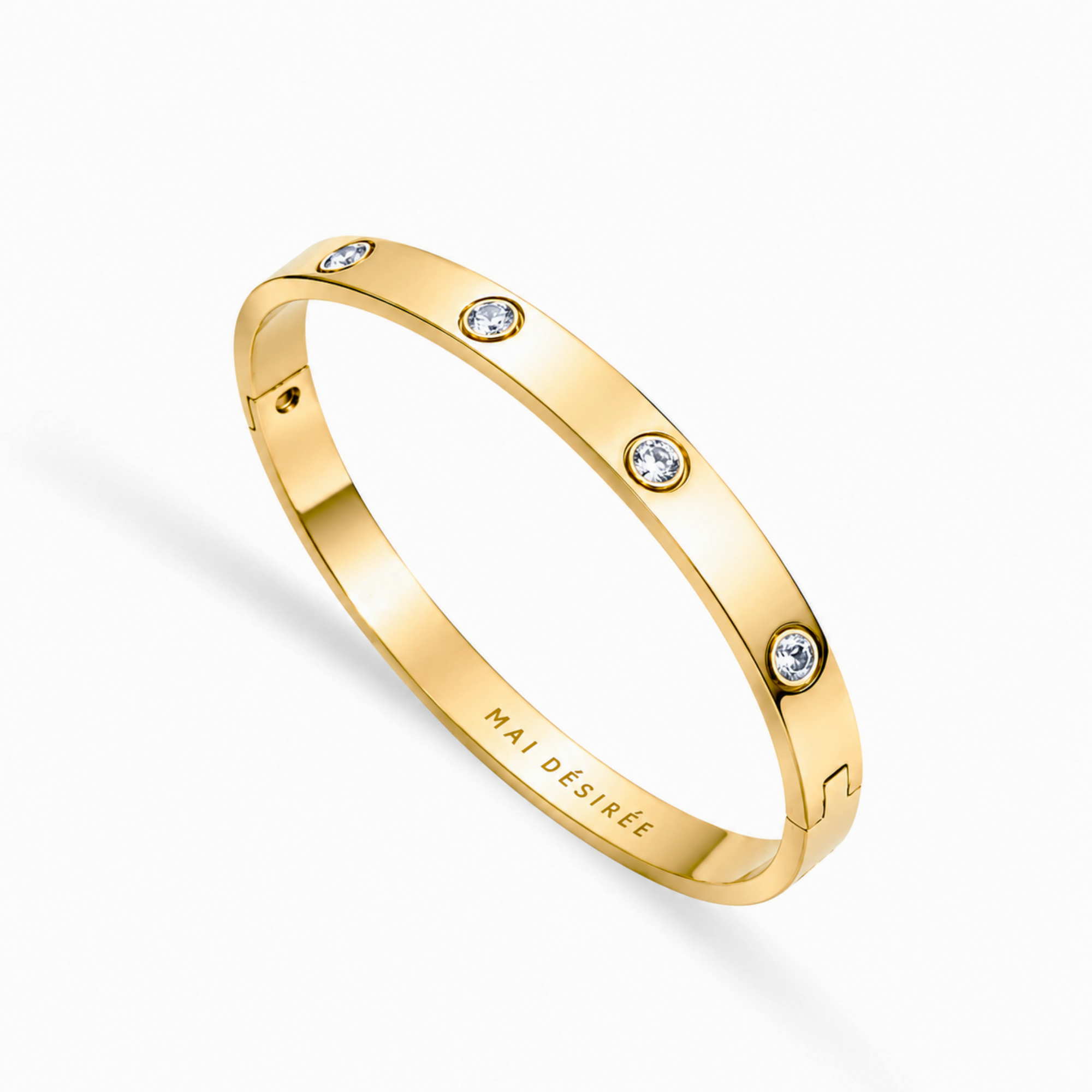 Gold bracelet with small diamonds on a white background
