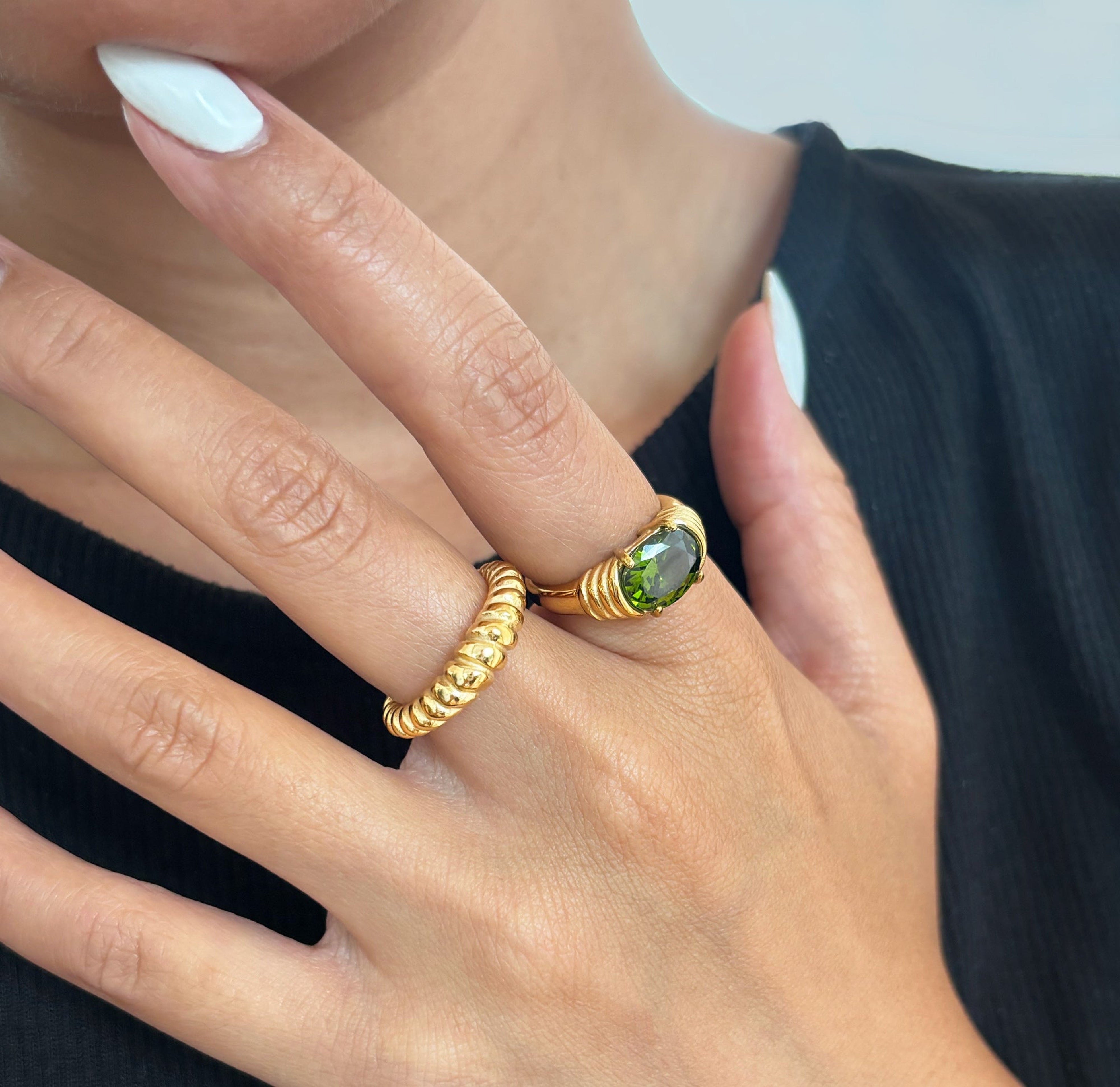 green gemstone heirloom ring worn on hand