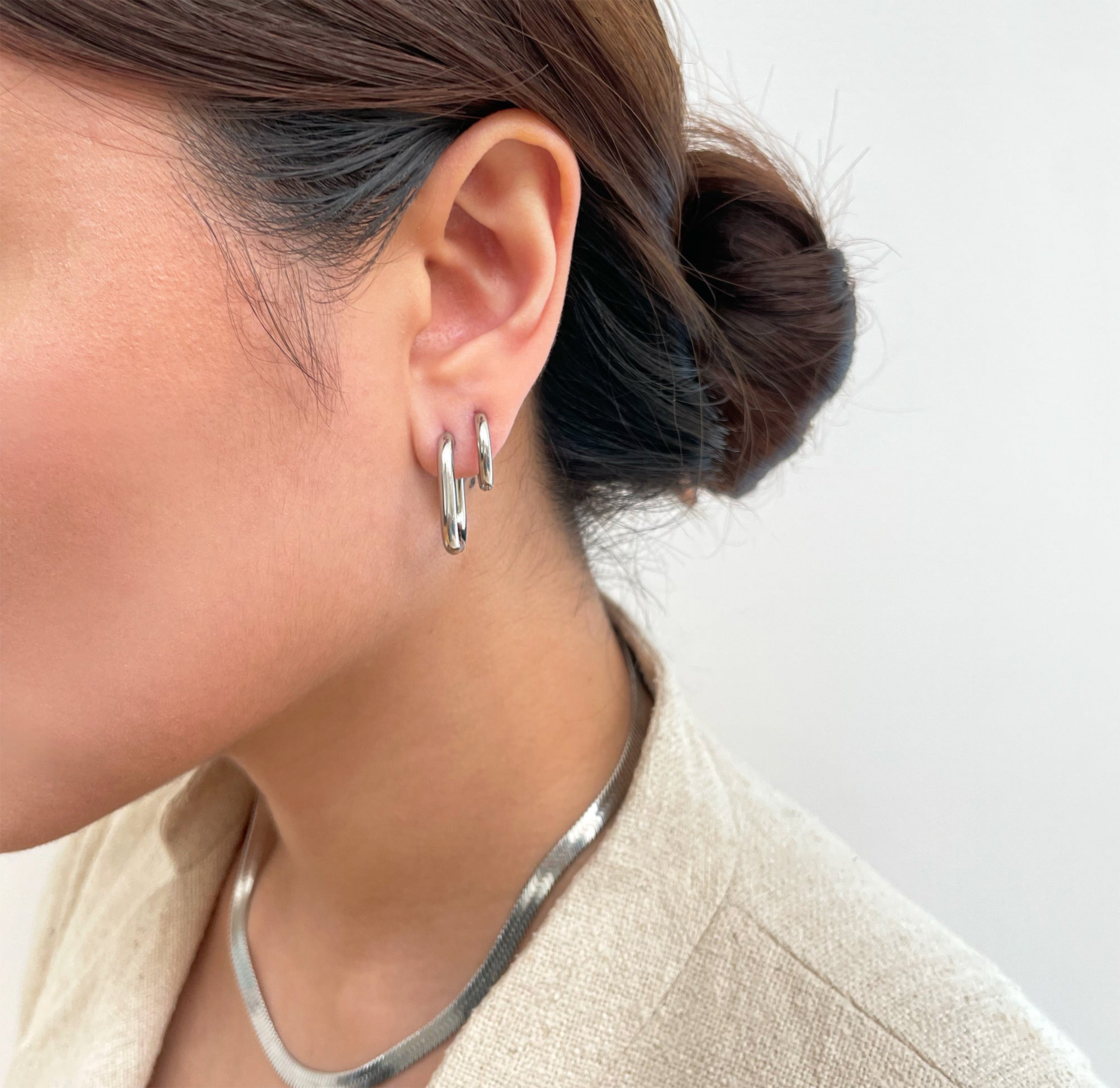 thin silver oval hoops waterproof jewelry