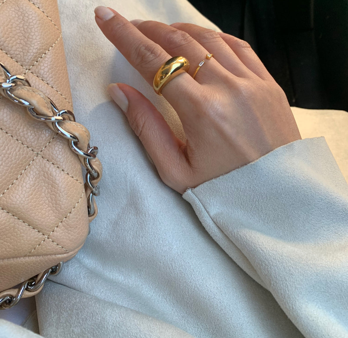 capri gold dome ring worn on model on pointer finger. waterproof jewelry