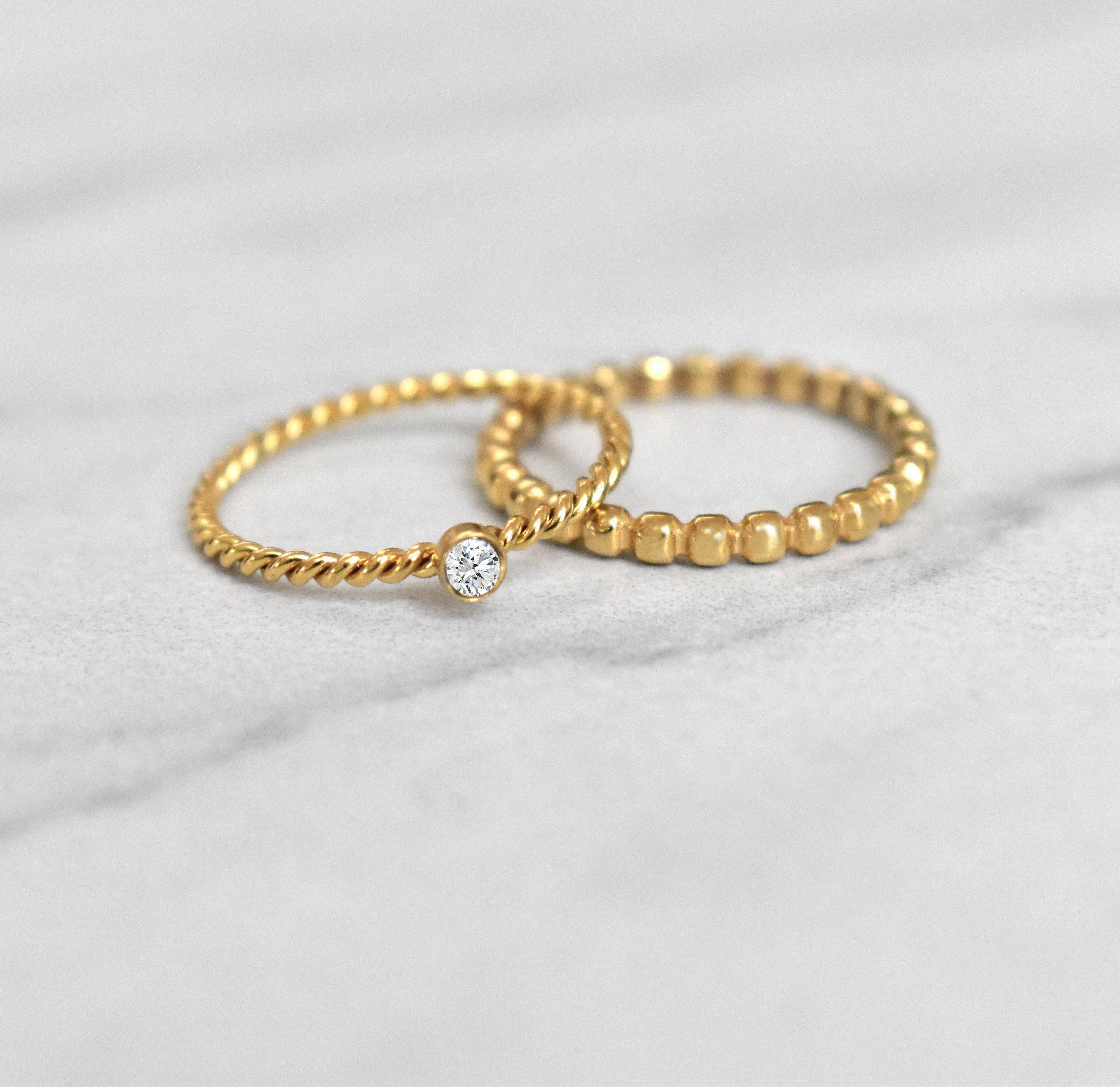 Naomi gold twist solitaire ring paired with Jaina thin beaded gold ring. Waterproof jewelry