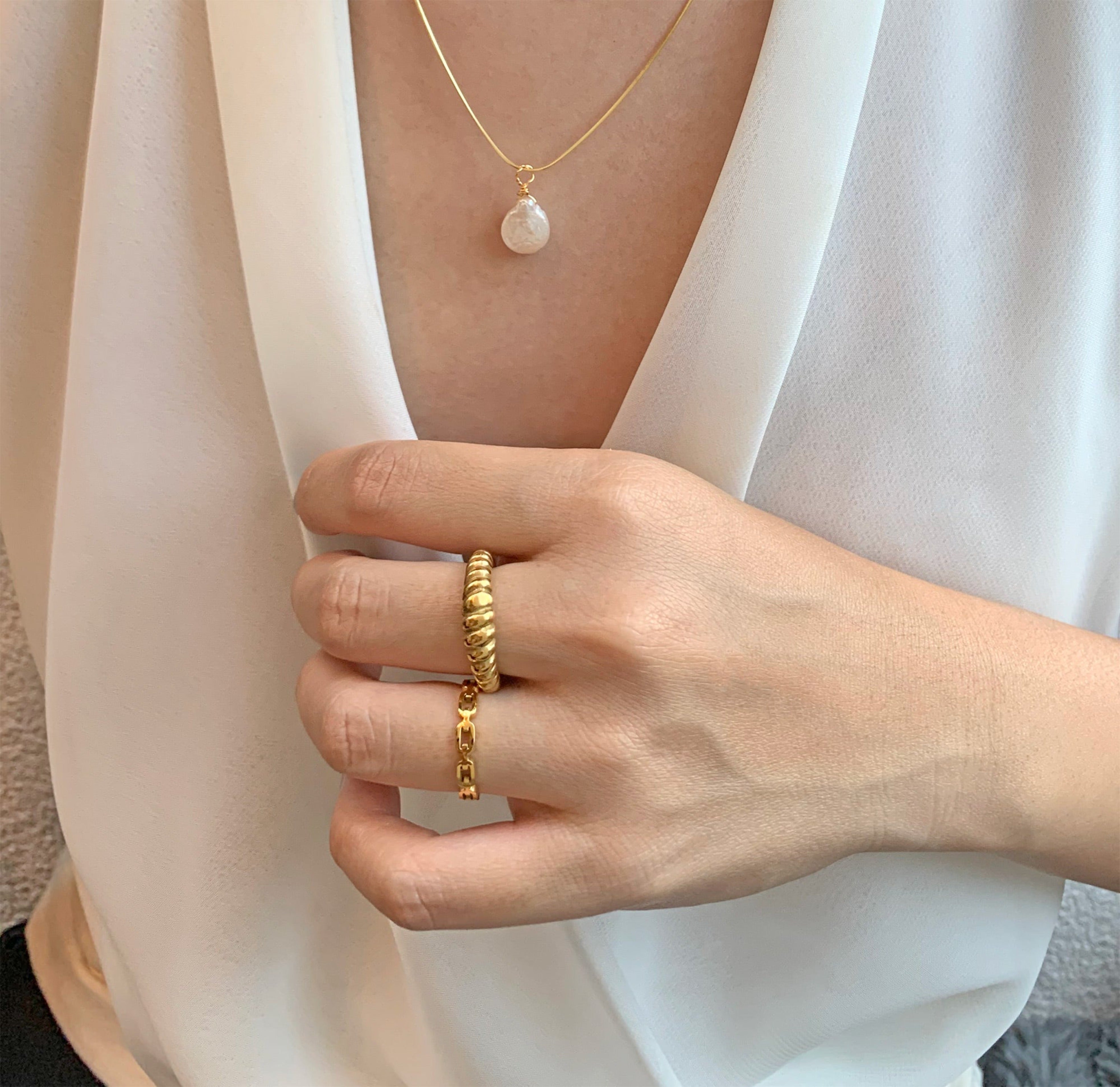 Dainty gold chain ring stacked with gold croissant ring waterproof rings