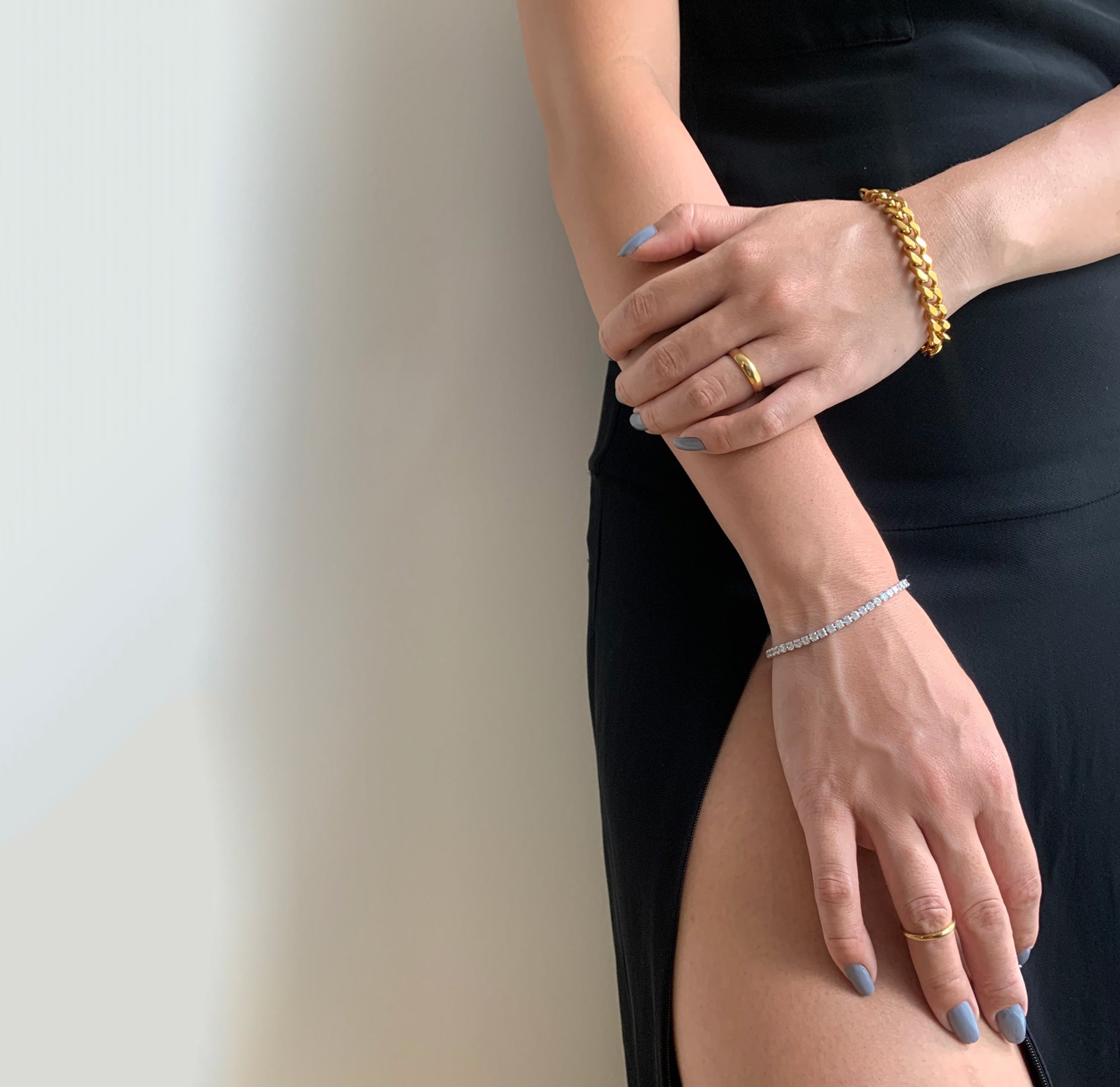 Carson medium gold ring band with a high polish finish and comfort fit worn on model. Waterproof Jewelry