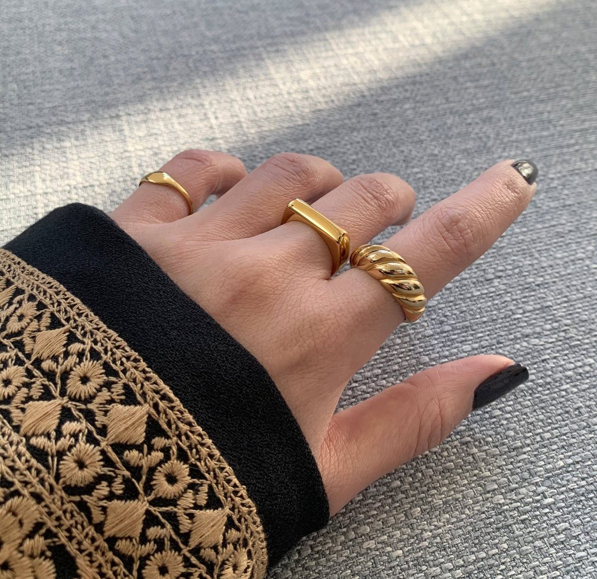 Drew dainty gold signet pink ring paired with Gold Margaux croissant ring worn on model, waterproof rings