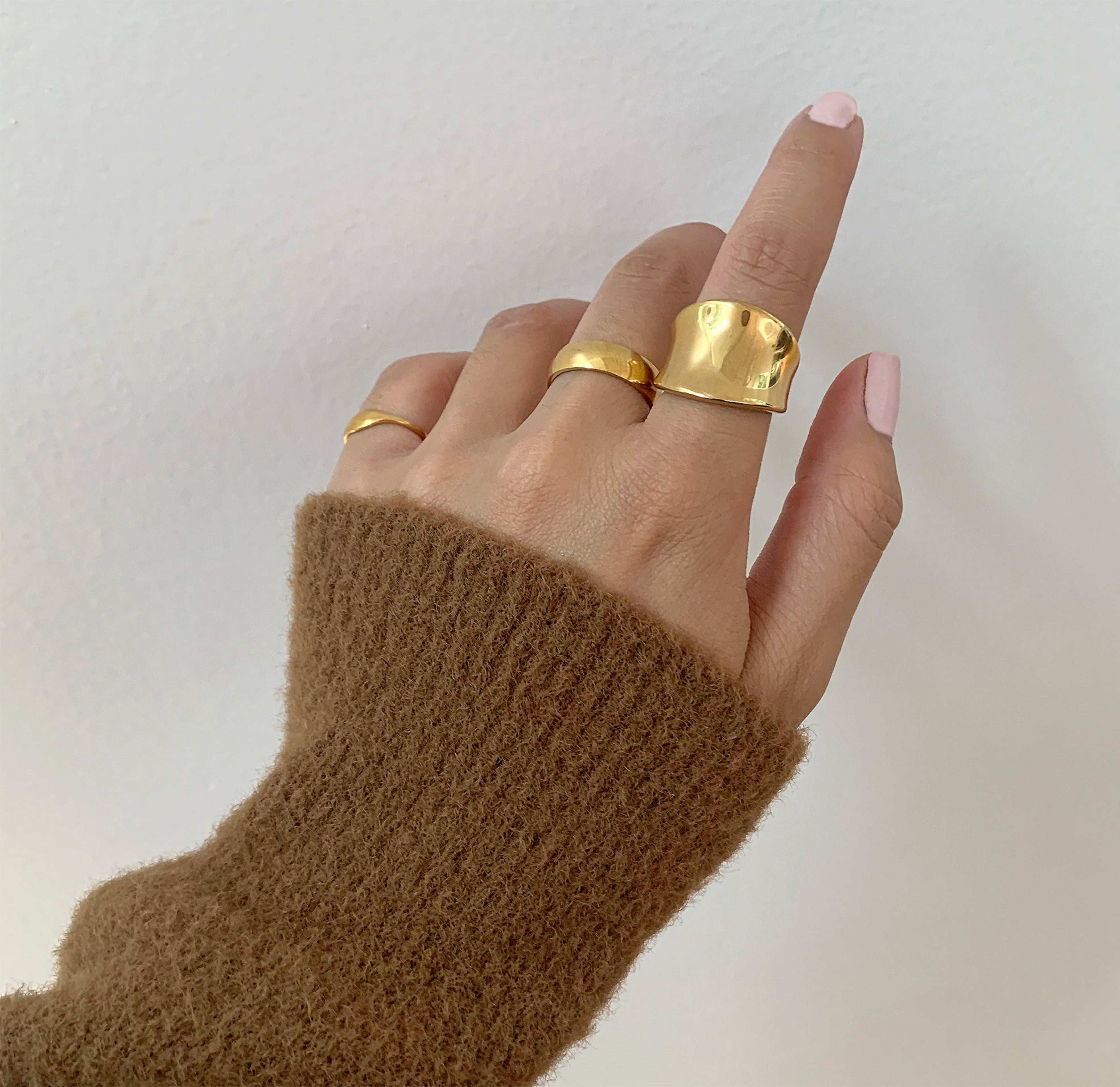 Jordyn gold saddle ring pair with Toni this gold ring band. Gold waterproof jewelry