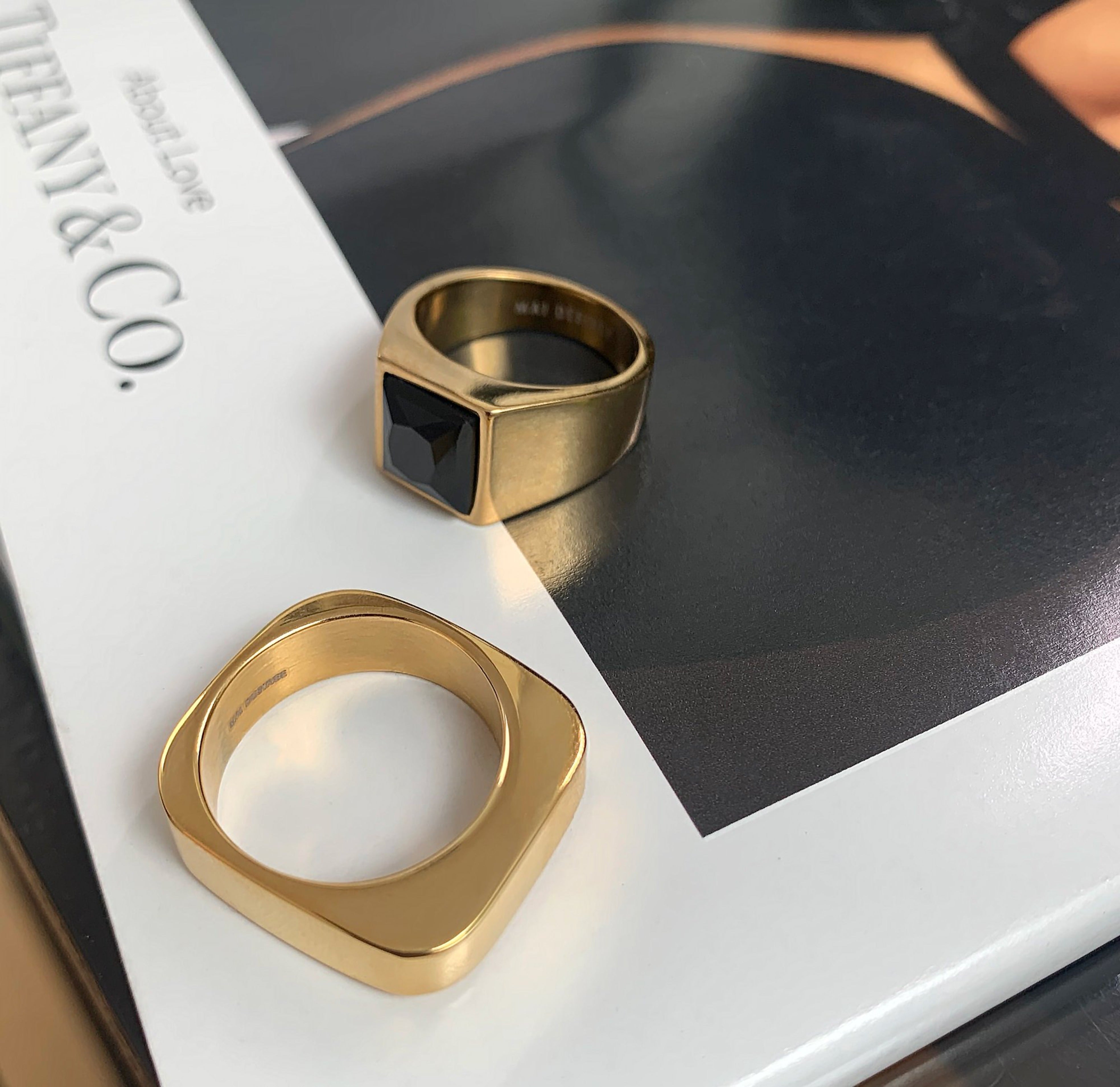 Whitney gold square ring paired with Chicago black onyx signet ring. Gold waterproof rings