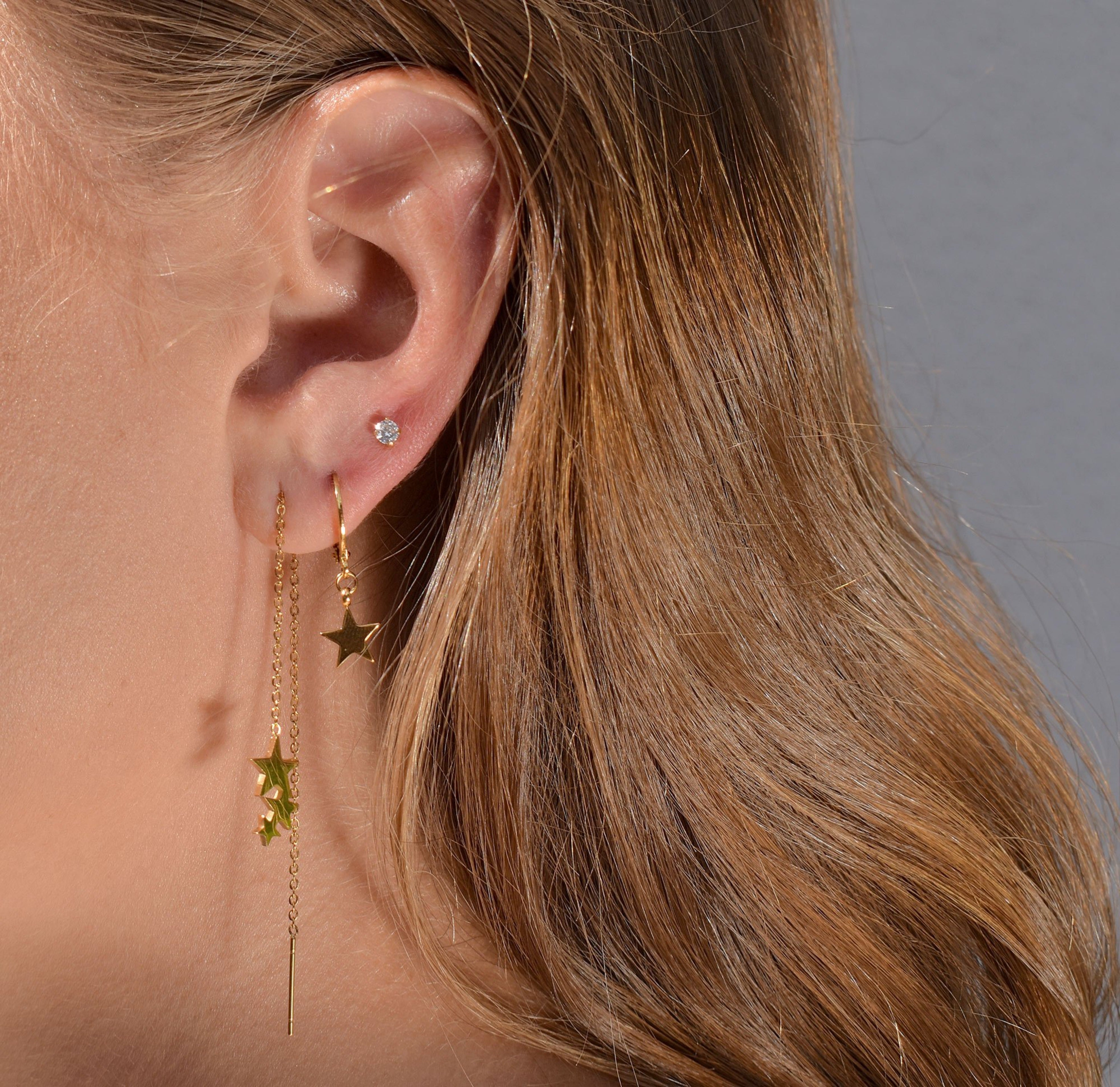 gold star huggie earring