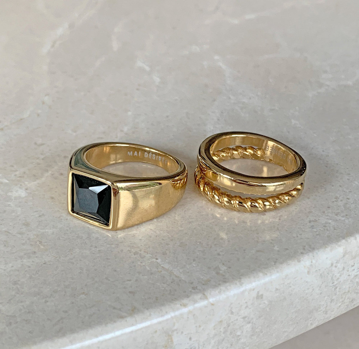 gold duo double ring band paired with gold onyx signet ring