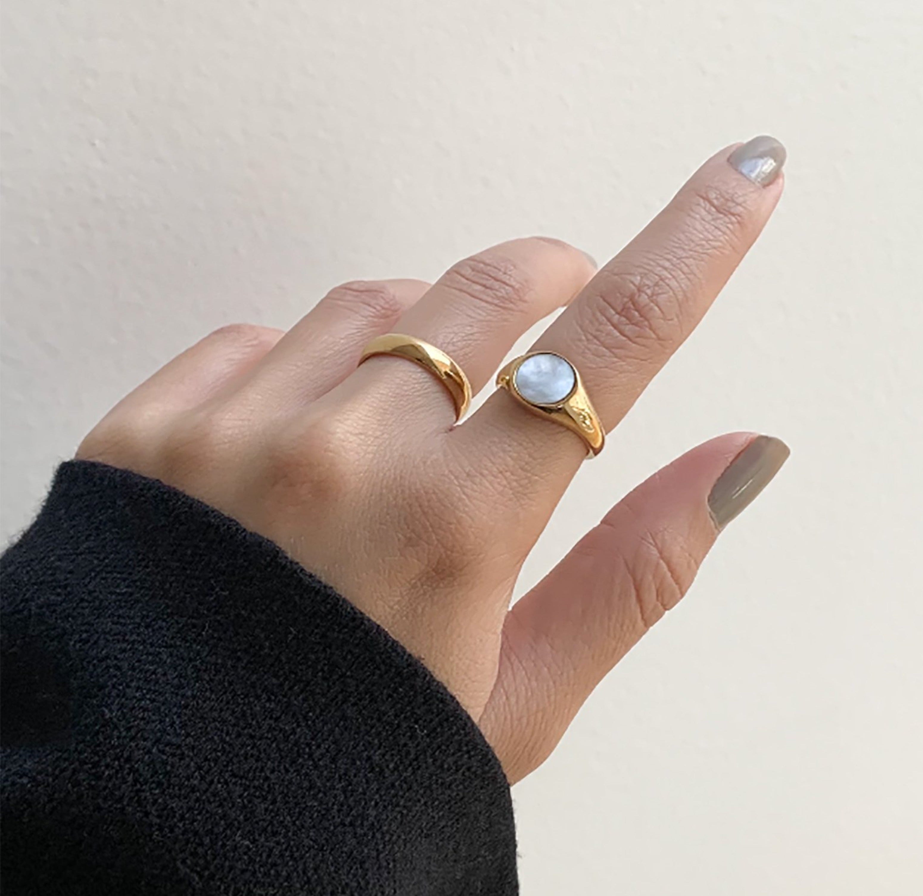 Demi gold round pearl signet ring paired with Carson classic gold ring band, waterproof jewelry