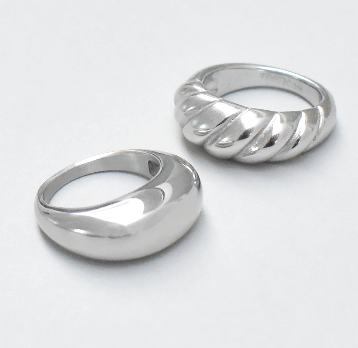 Silver classic croissant ring paired with capri silver dome ring. Waterproof rings