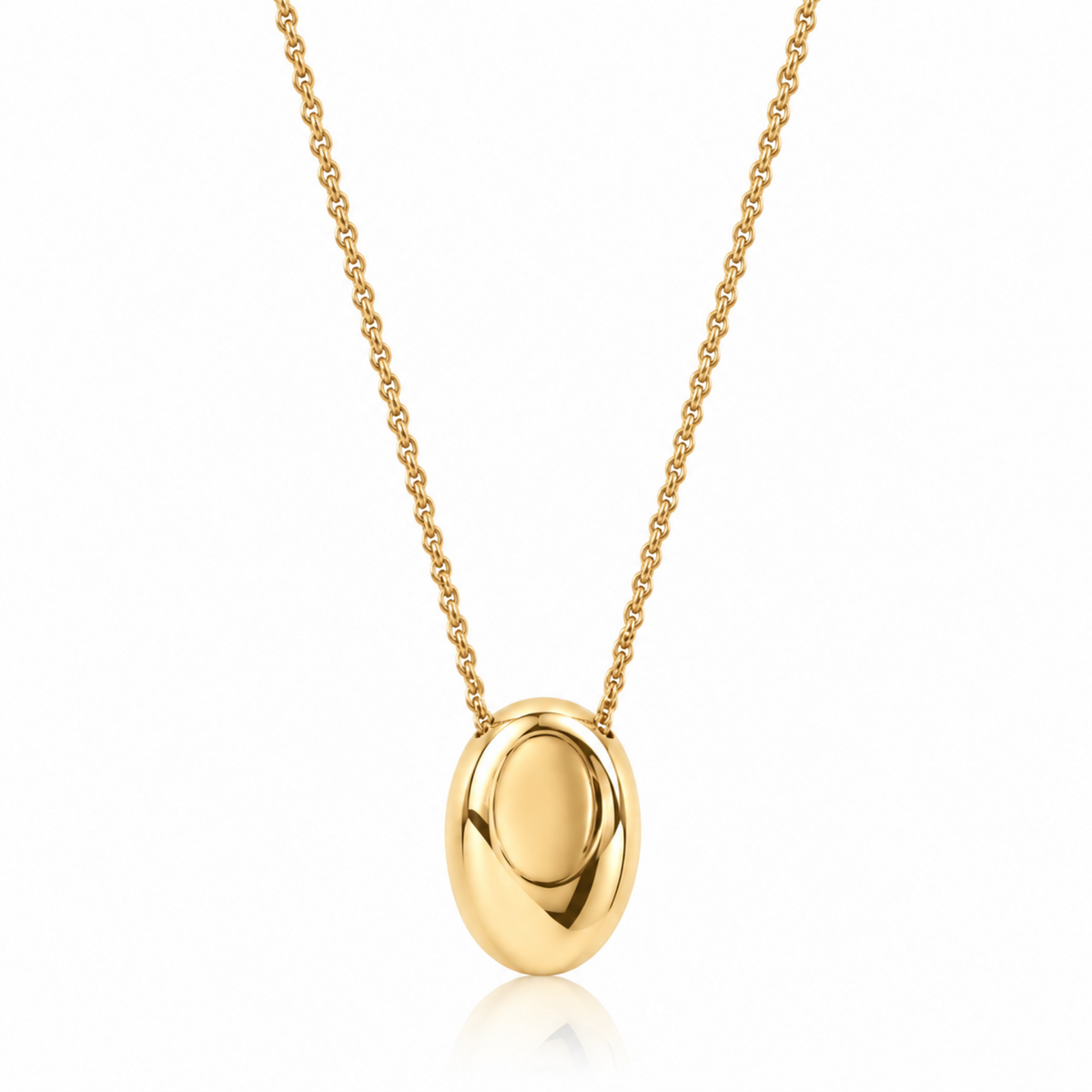A polished yellow gold oval pendant necklace on a delicate gold chain, presented against a clean white background with a subtle reflection.
