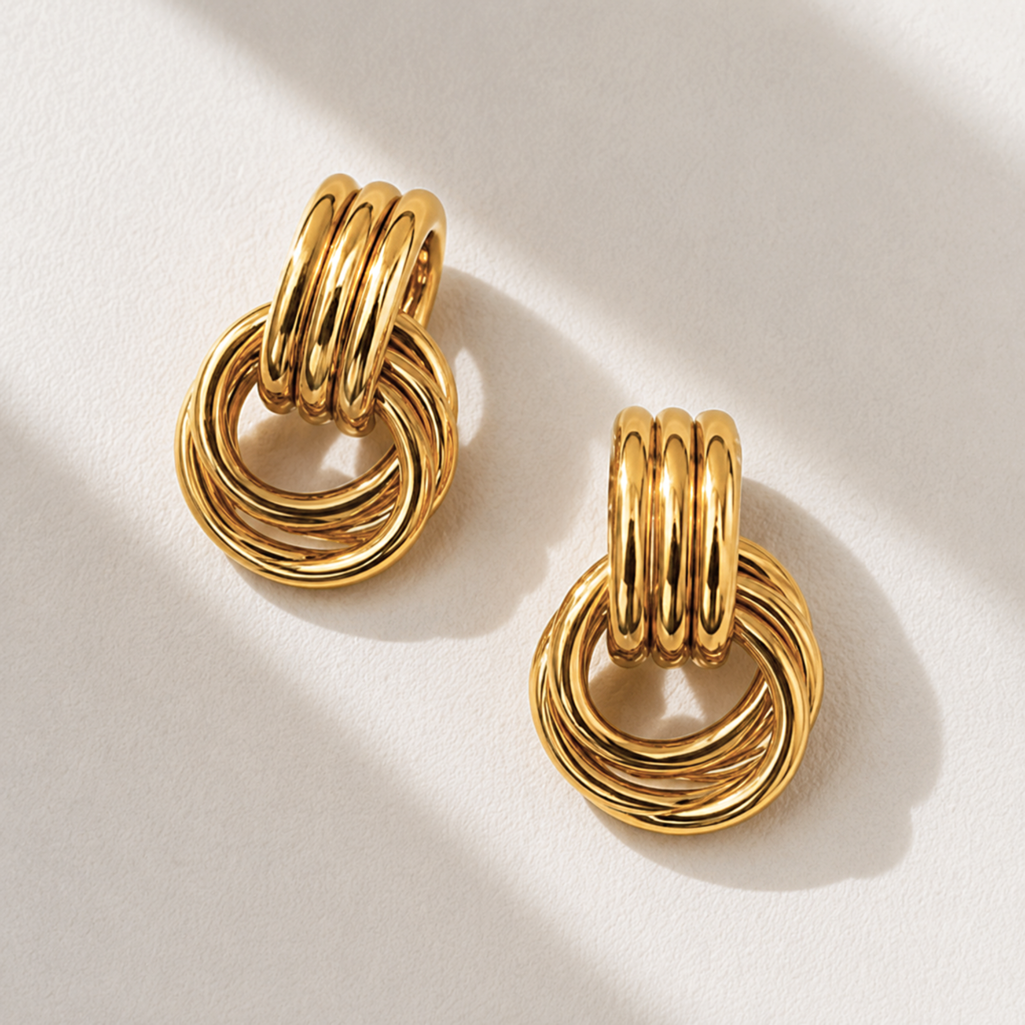 Pair of gold door knocker earrings waterproof jewelry
