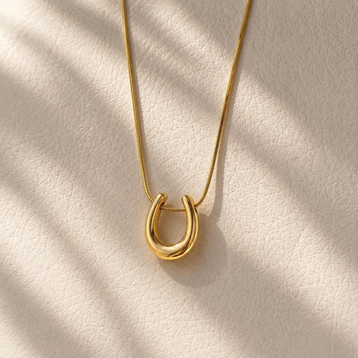 gold horse shoe necklace high polish finish