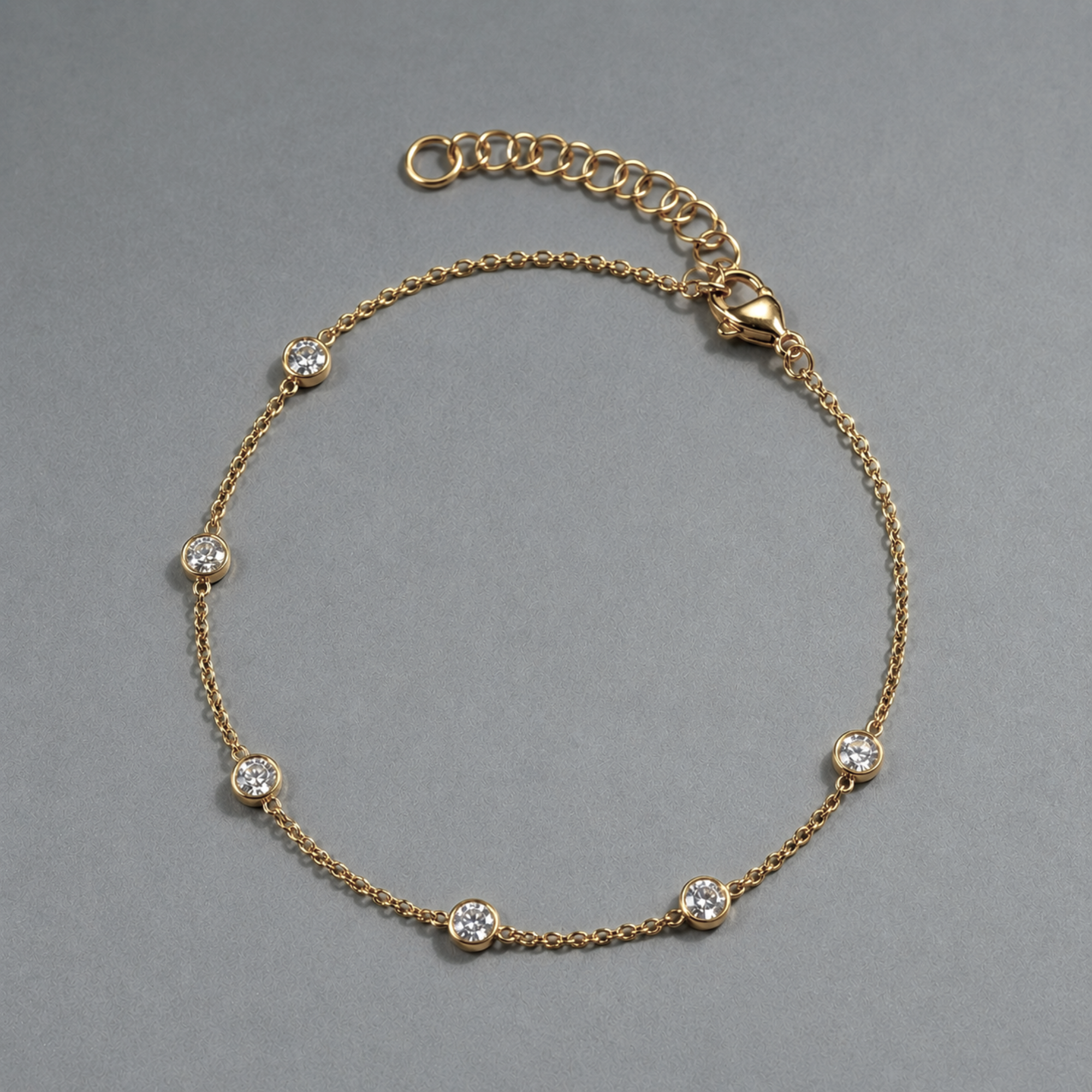 gold_station_anklet_bracelet on grey background