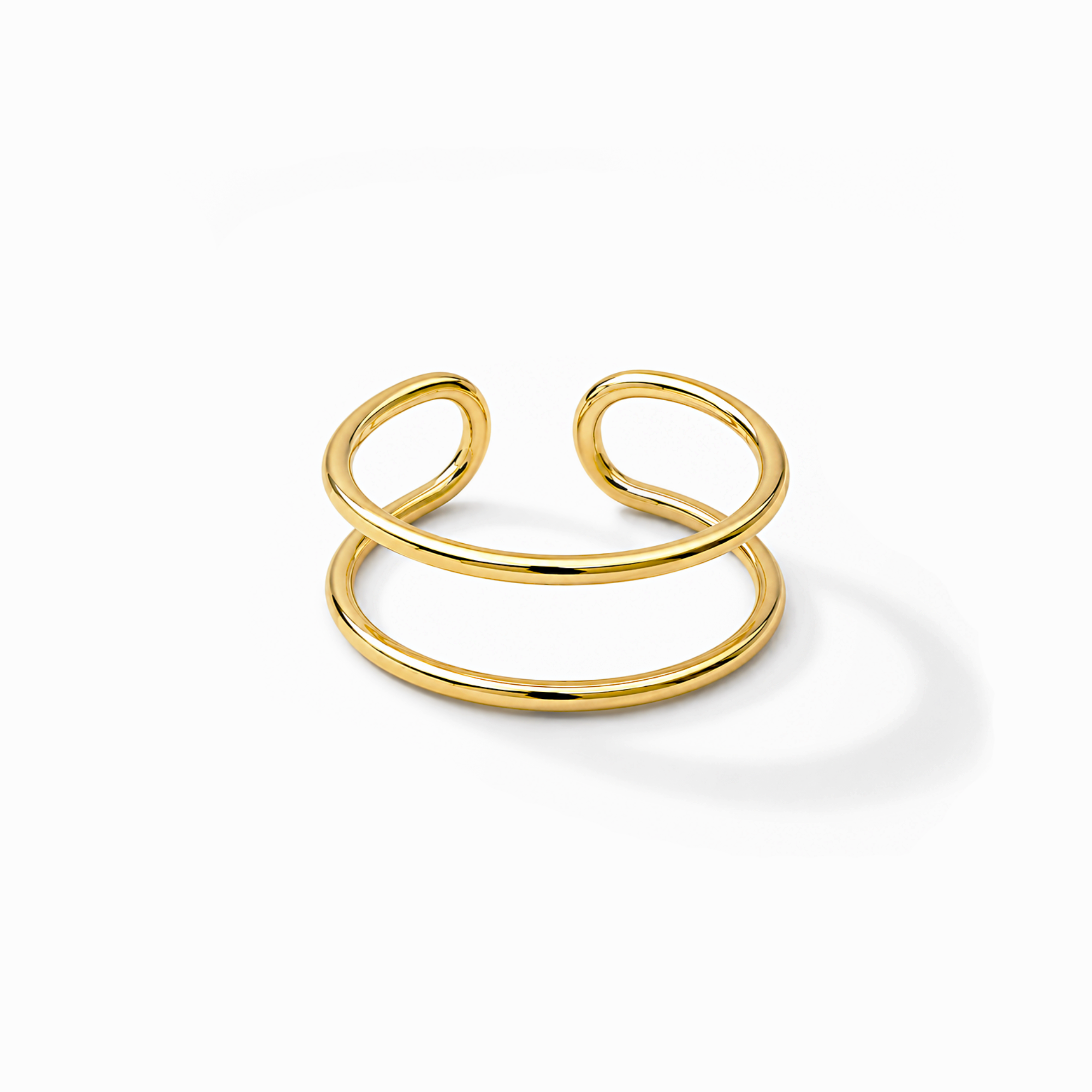 Gold ring with a double thin band design on a white background
