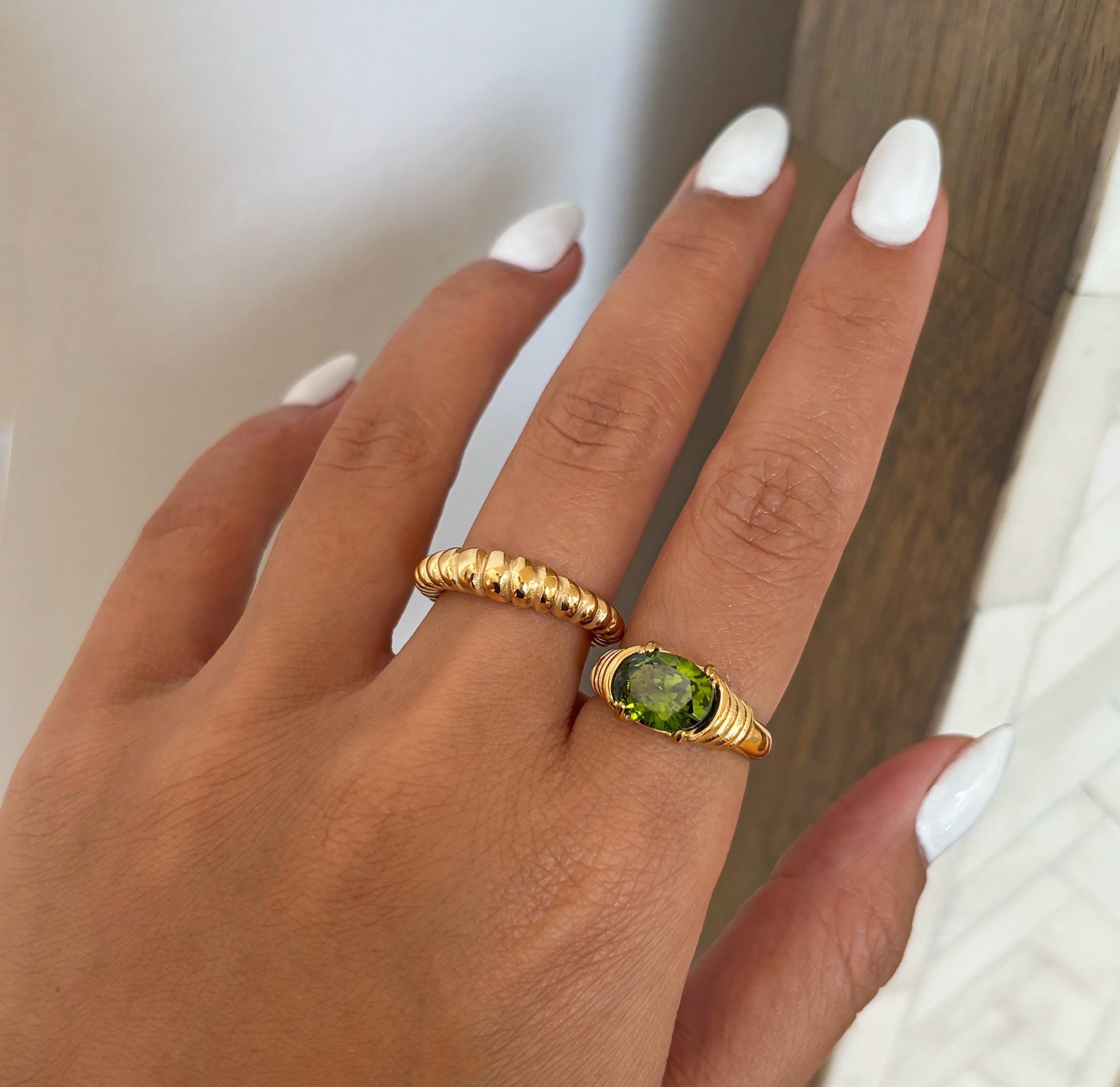 green gemstone heirloom ring worm on hand