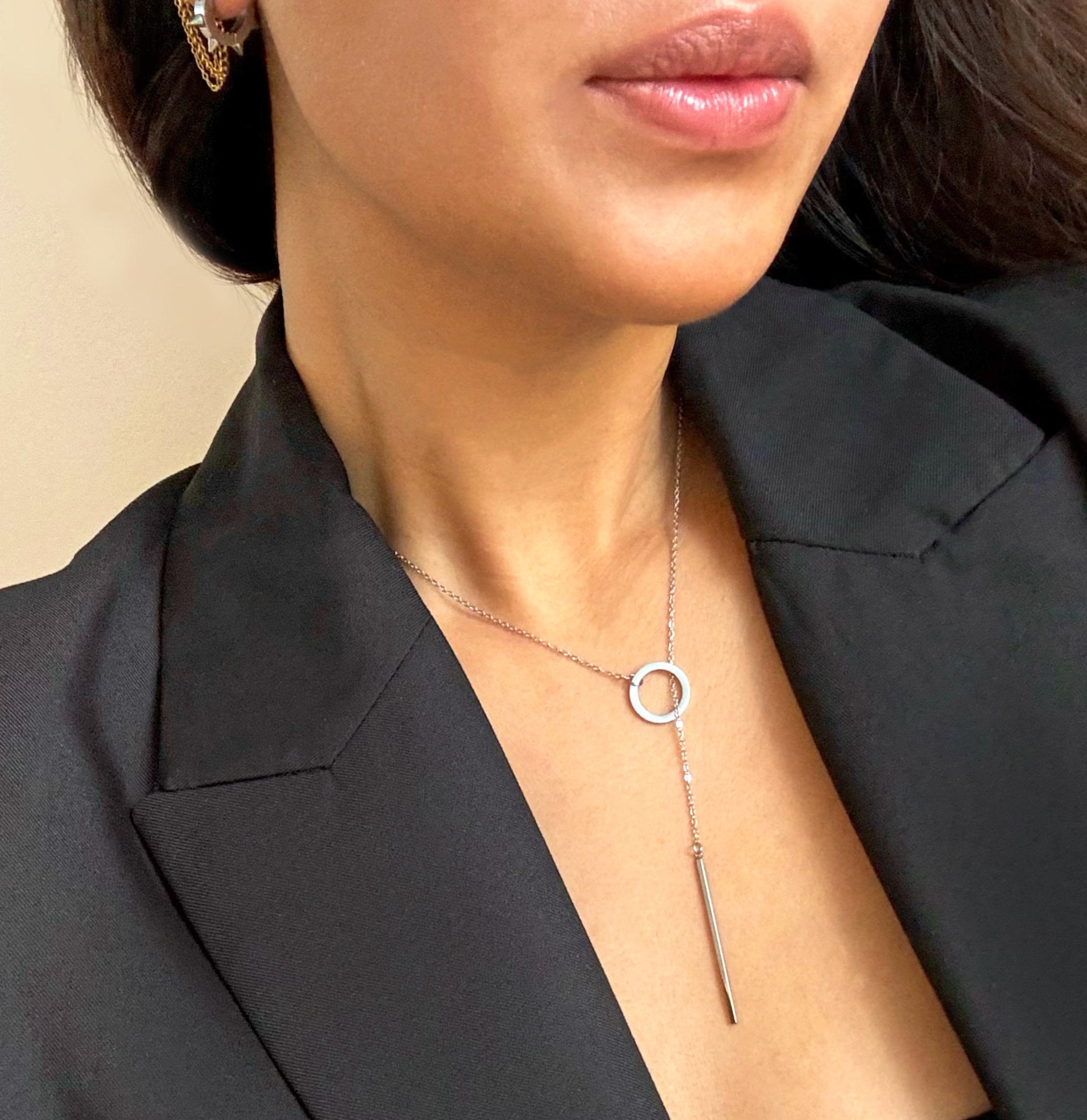 silver circle bar lariat necklace on model waterproof jewelry