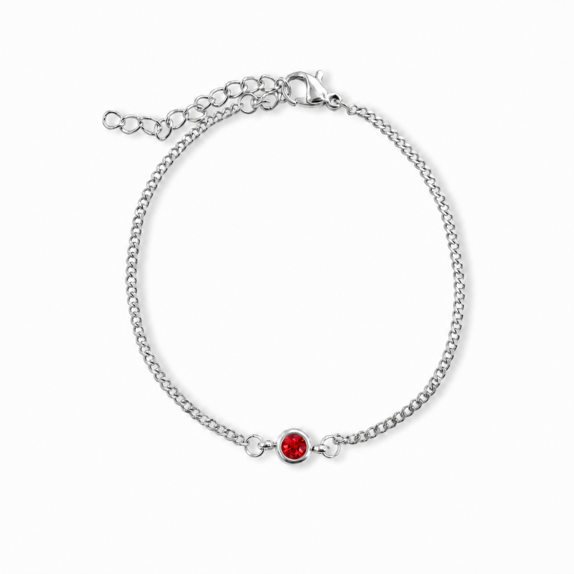 A silver chain bracelet with a small bright red gemstone accent, displayed on a clean white background. July birthstone jewelry