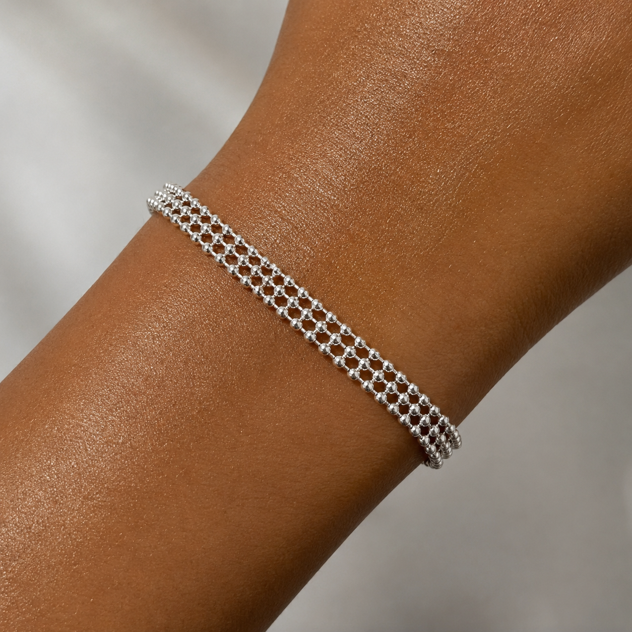 silver beaded chain bracelet on wrist