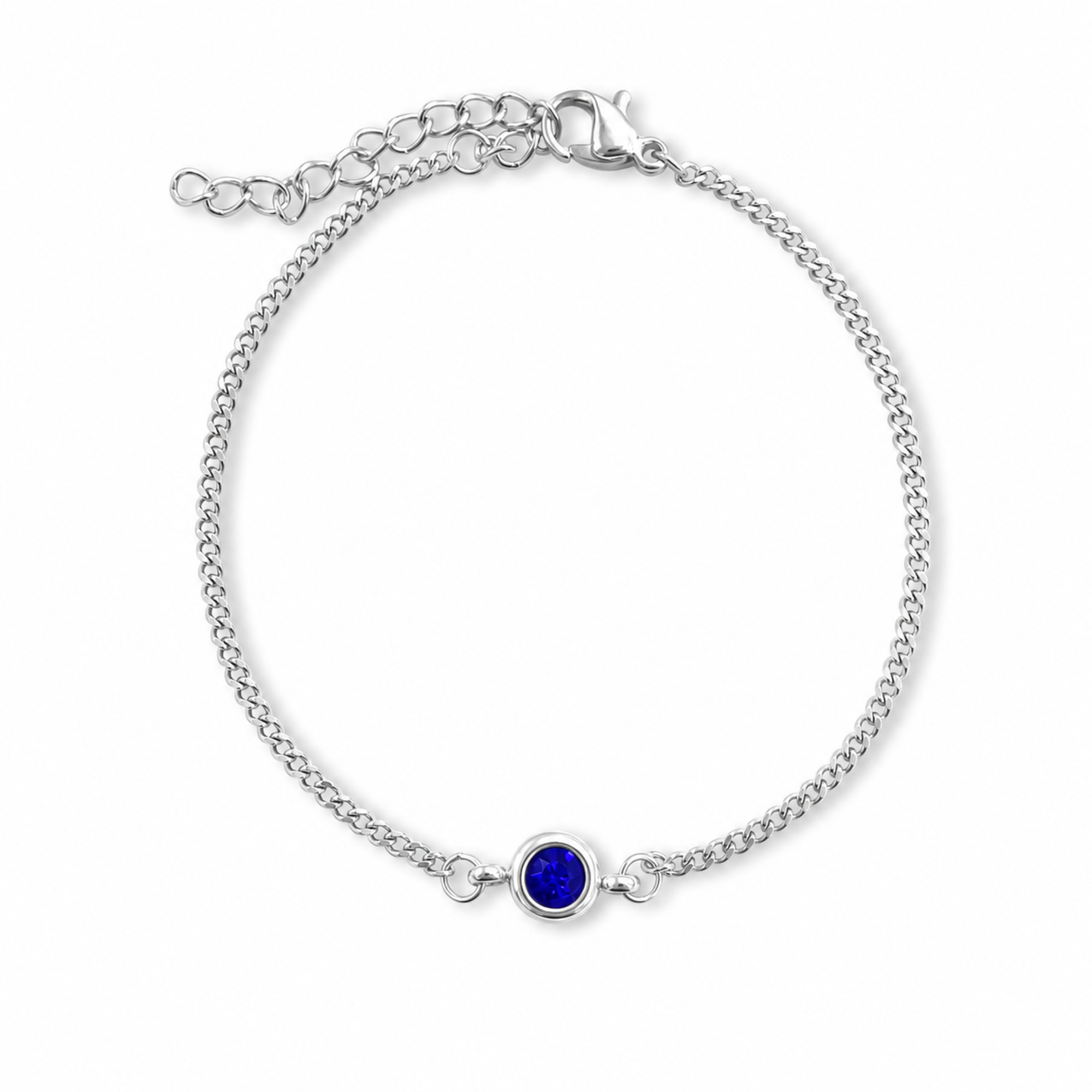 A silver chain bracelet with an adjustable lobster clasp and extender chain, featuring a central bezel-set round deep blue gemstone, shown on a plain white background.