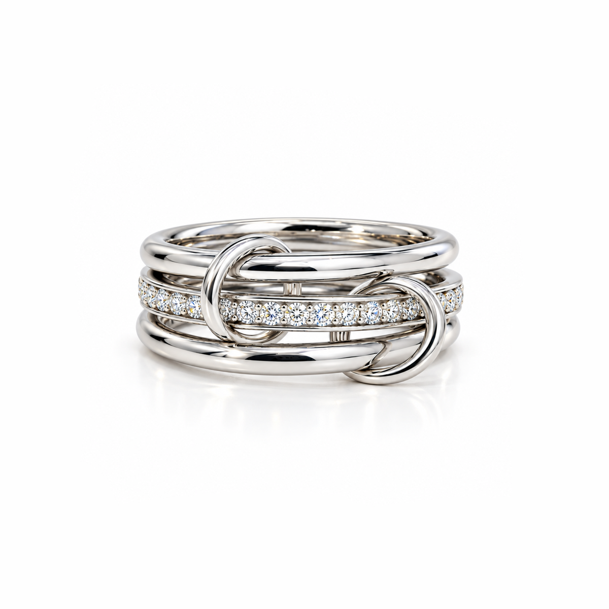 A silver-toned multi-band ring with one band paved with small clear stones, shown on a clean white background.
