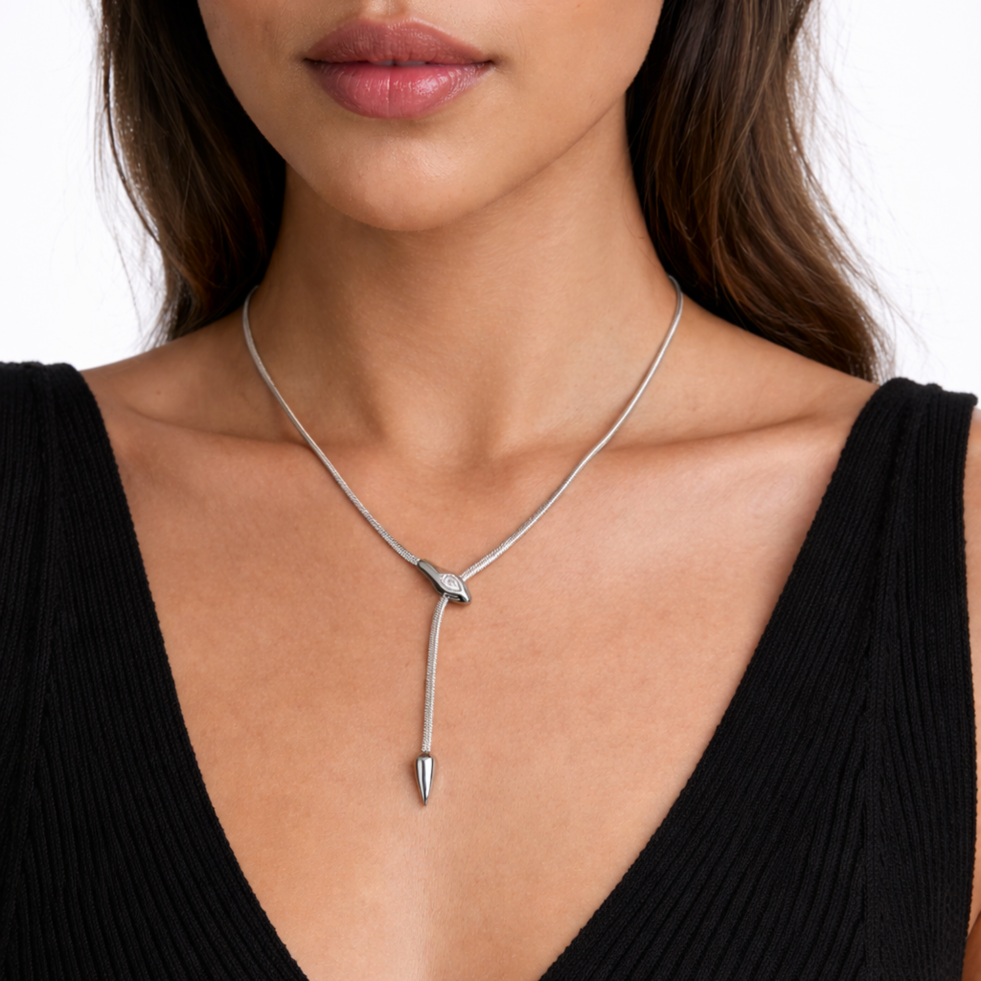 Silver serpentine necklace with a pendant worn by a model on a white background