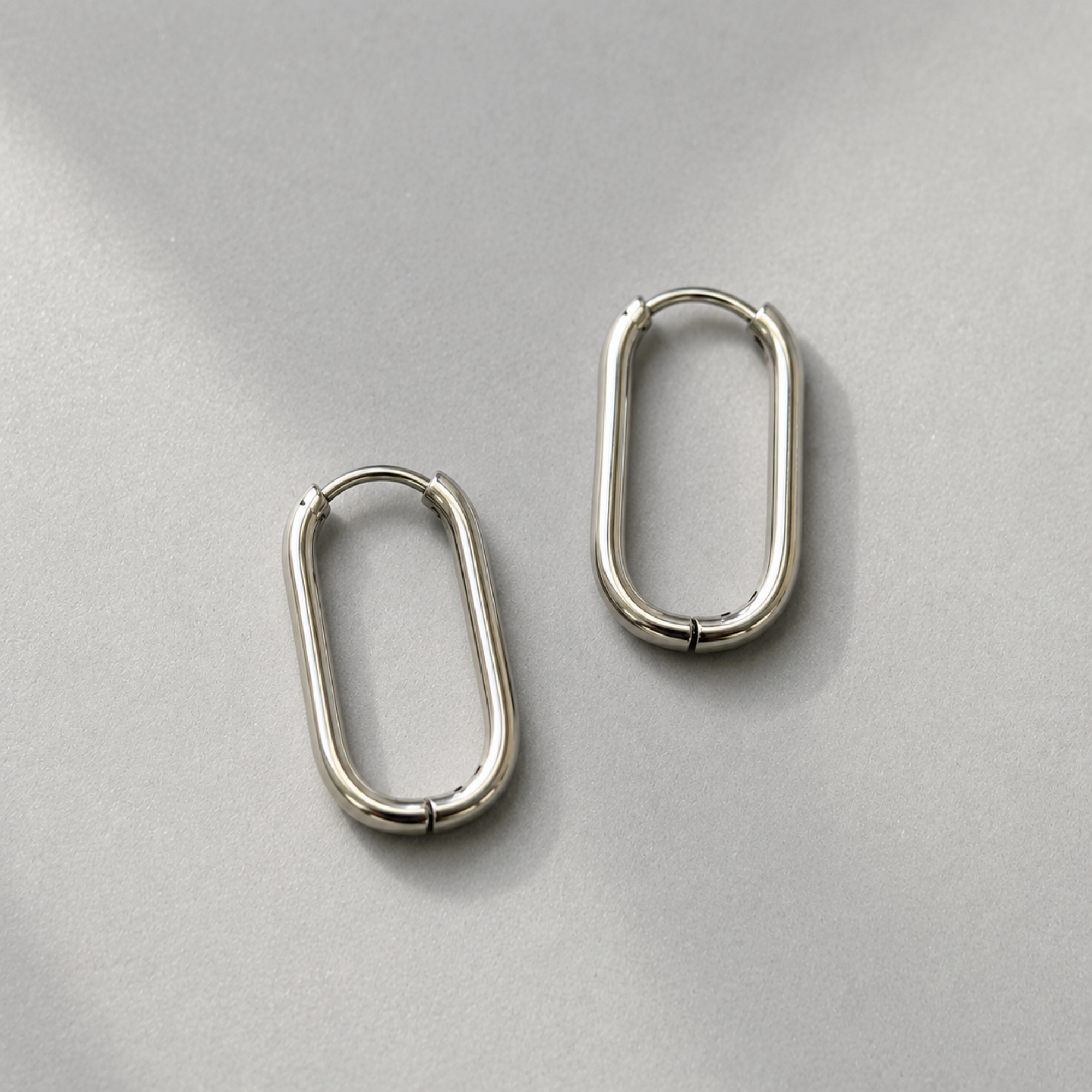 THIN SILVER OVAL HOOP EARRINGS - SAMPLE