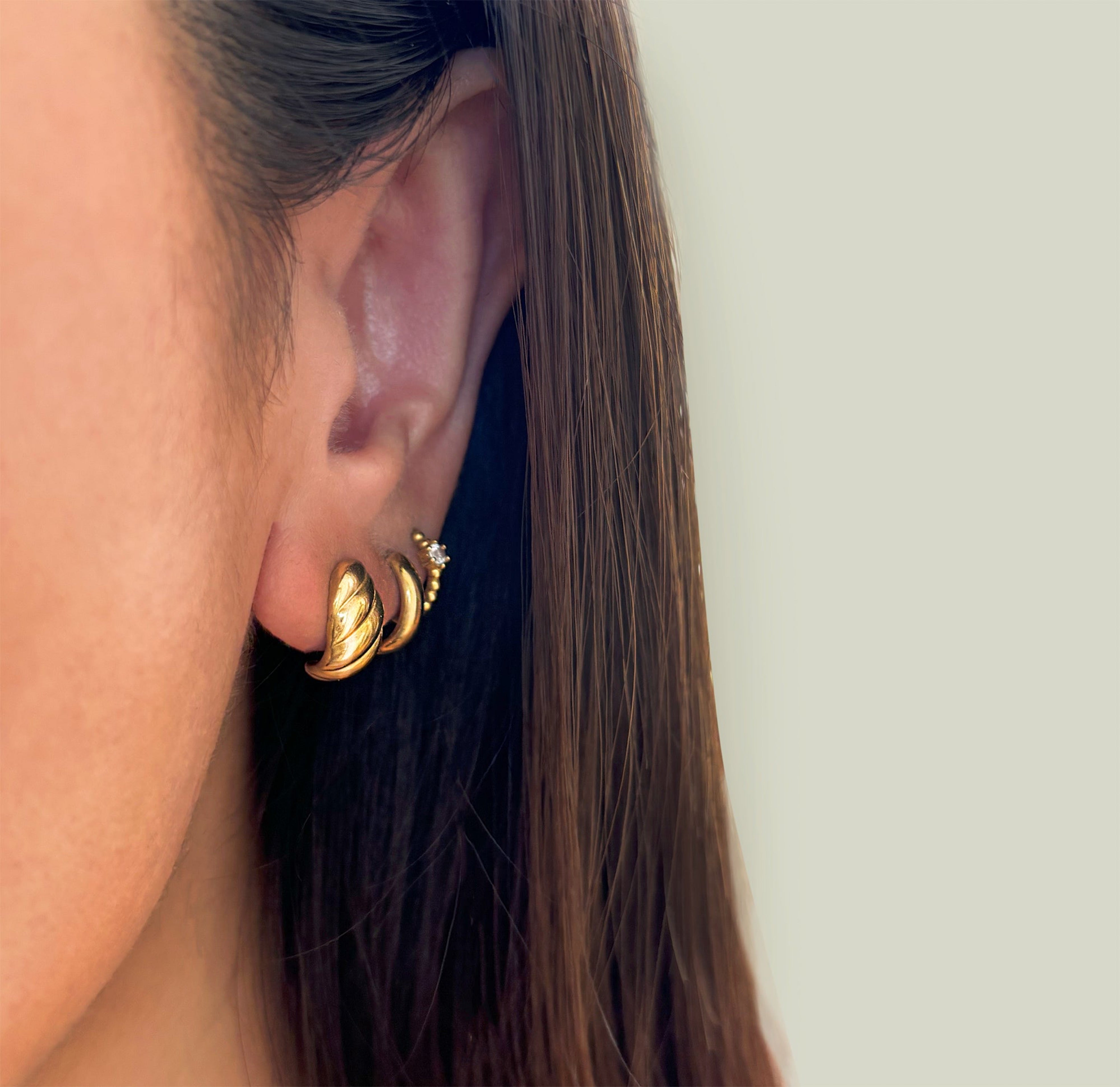 gold croissant stud earrings waterproof jewelry worn on model