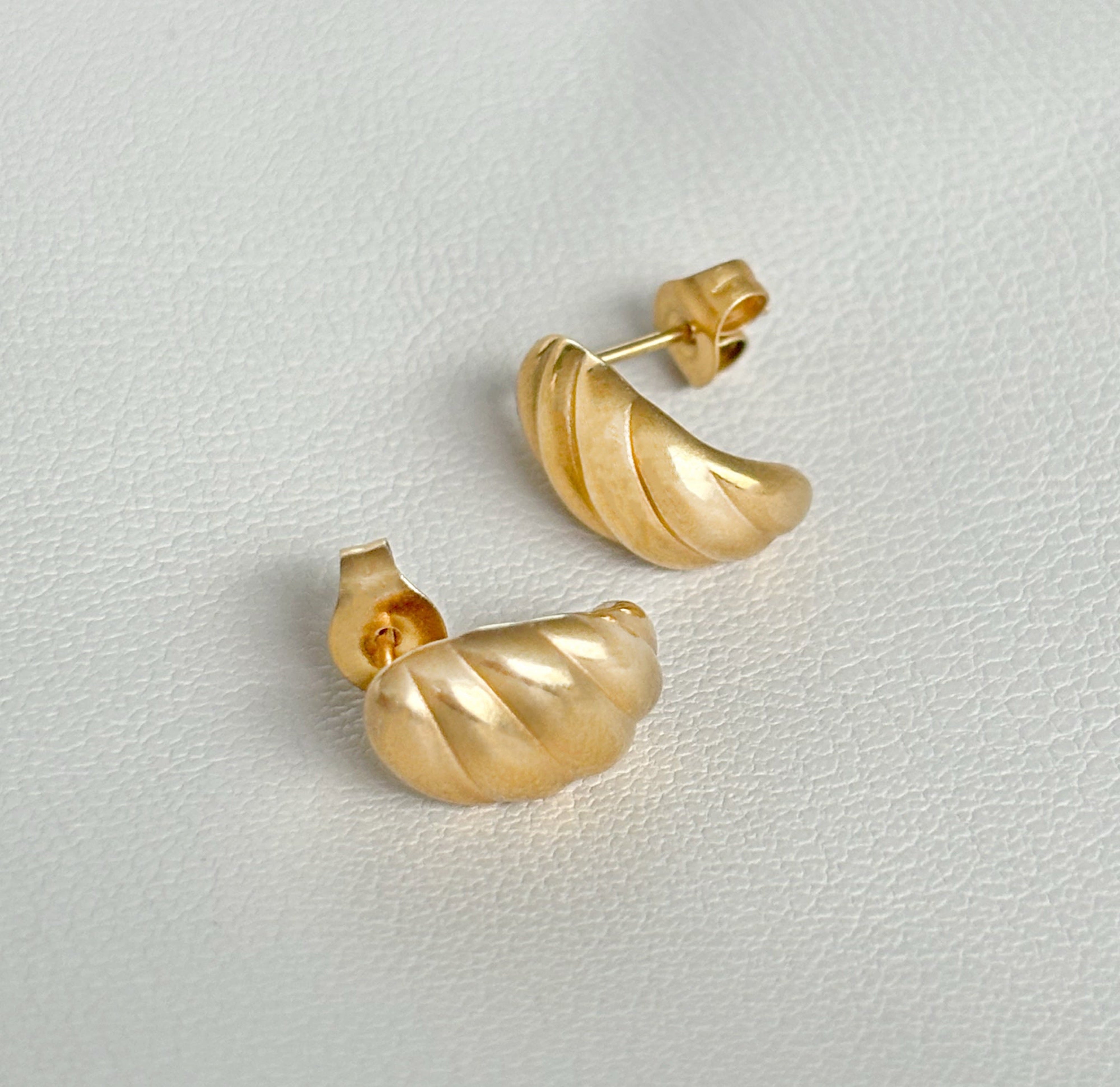 gold croissant stud earrings waterproof jewelry flat lay